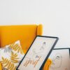 Floral print above yellow sofa