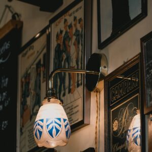 Framed art beside vintage lamp
