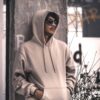 Grey hoodie leaning on wall