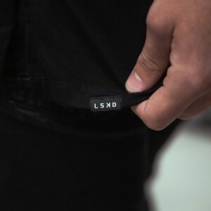 Holding a black tee