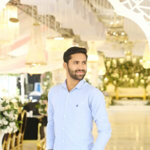 Man in blue shirt indoors
