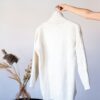 White sweater on rack