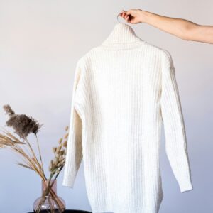 White sweater on rack