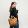 Woman carrying leather handbag