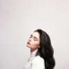 Woman in white top