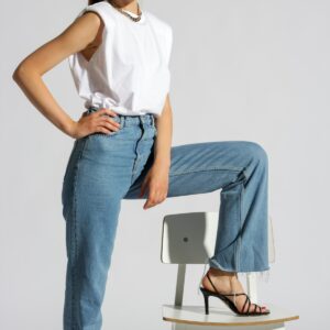 Woman in blue jeans seated