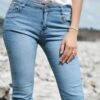 Woman in jeans and white top