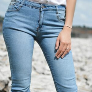 Woman in jeans and white top