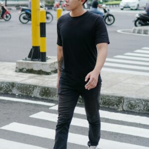 Black tee on sidewalk