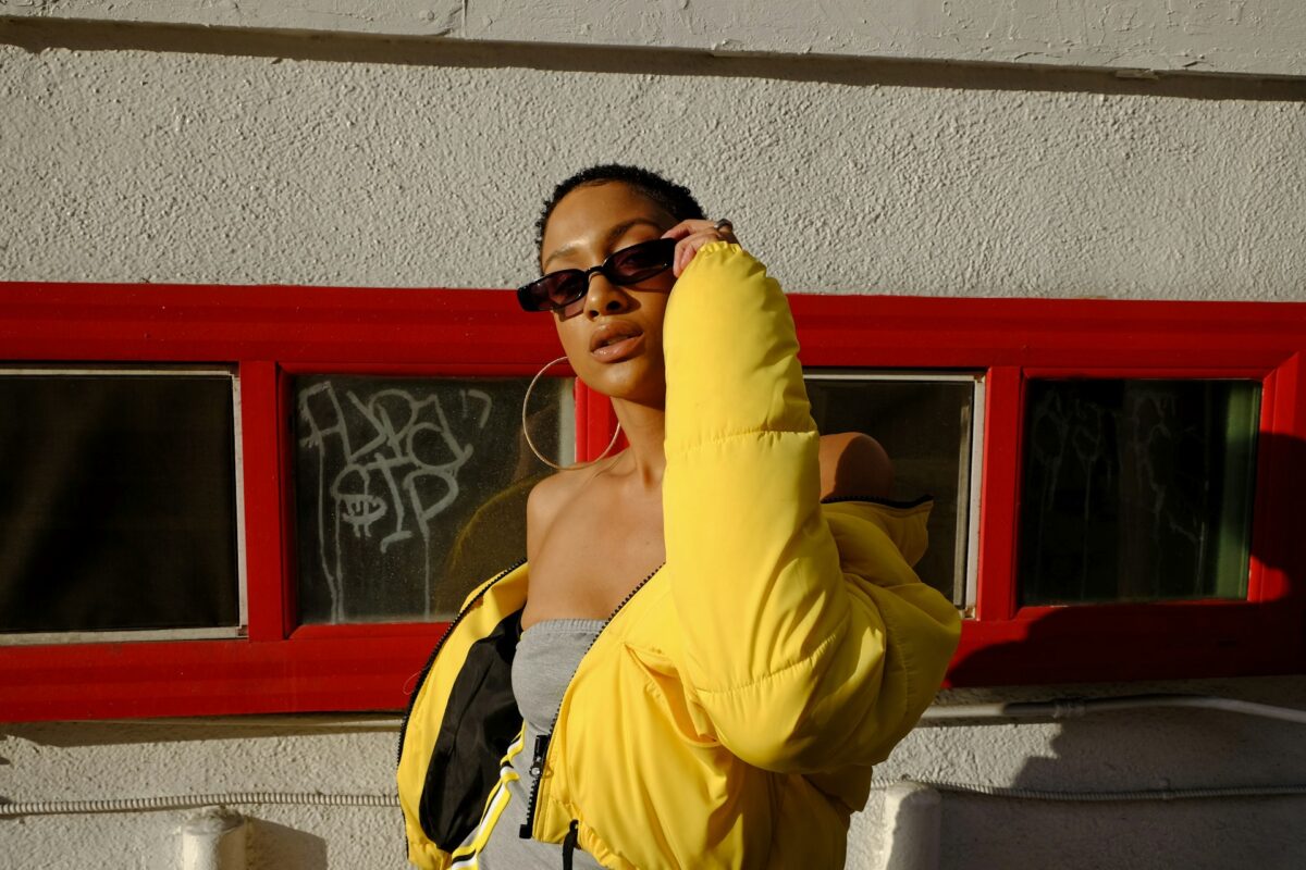 Woman holding sunglasses